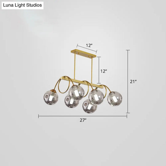 Sleek Gold Spiral Island Light - Post-Modern Metal Ceiling Hang Lamp With Ball Glass Shade