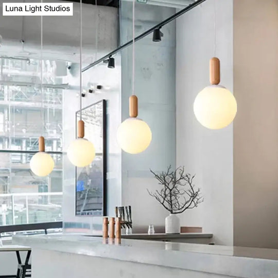 Sleek Sphere Kitchen Pendant Light: White/Cognac Glass Minimalist Design With Wood Grip