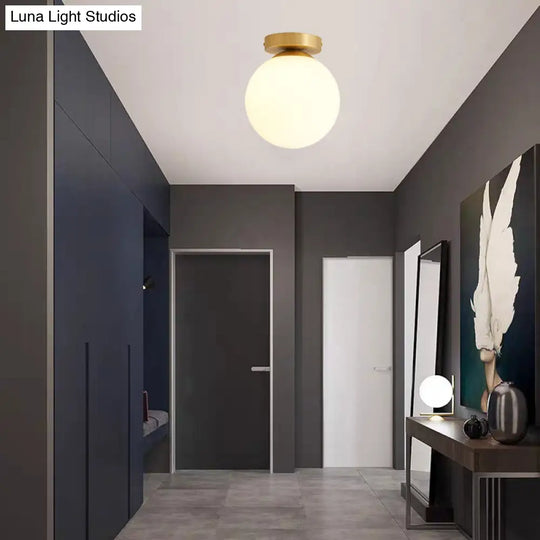 Sleek Minimalist Single Entryway Flush Mount Ceiling Light With Gold Accent & White Glass