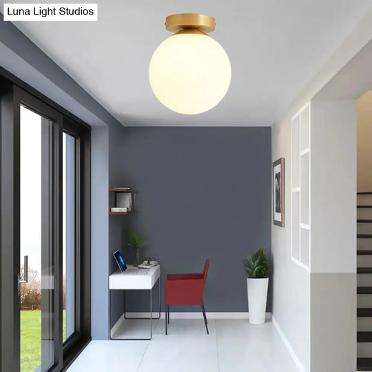 Sleek Minimalist Single Entryway Flush Mount Ceiling Light With Gold Accent & White Glass