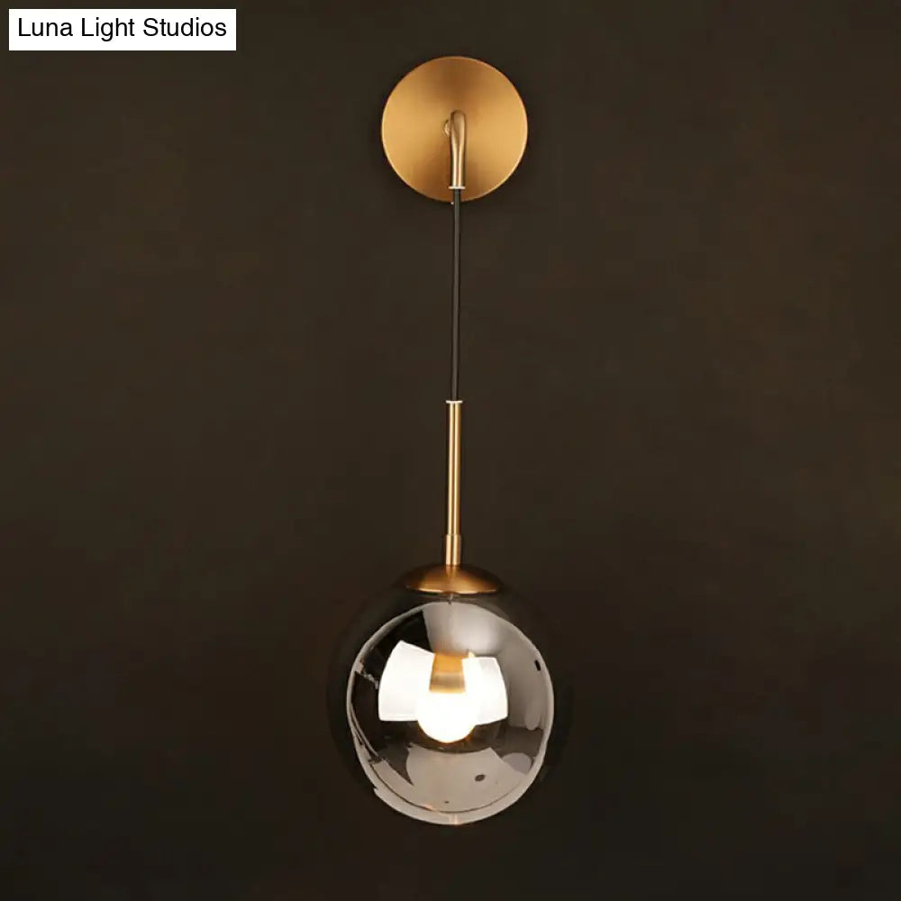 Sleek Silver Glass Ball Wall Hanging Lamp With Brass Mount - Perfect Bedroom Lighting Solution