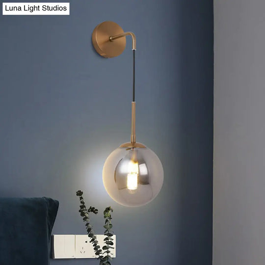 Sleek Silver Glass Ball Wall Hanging Lamp With Brass Mount - Perfect Bedroom Lighting Solution