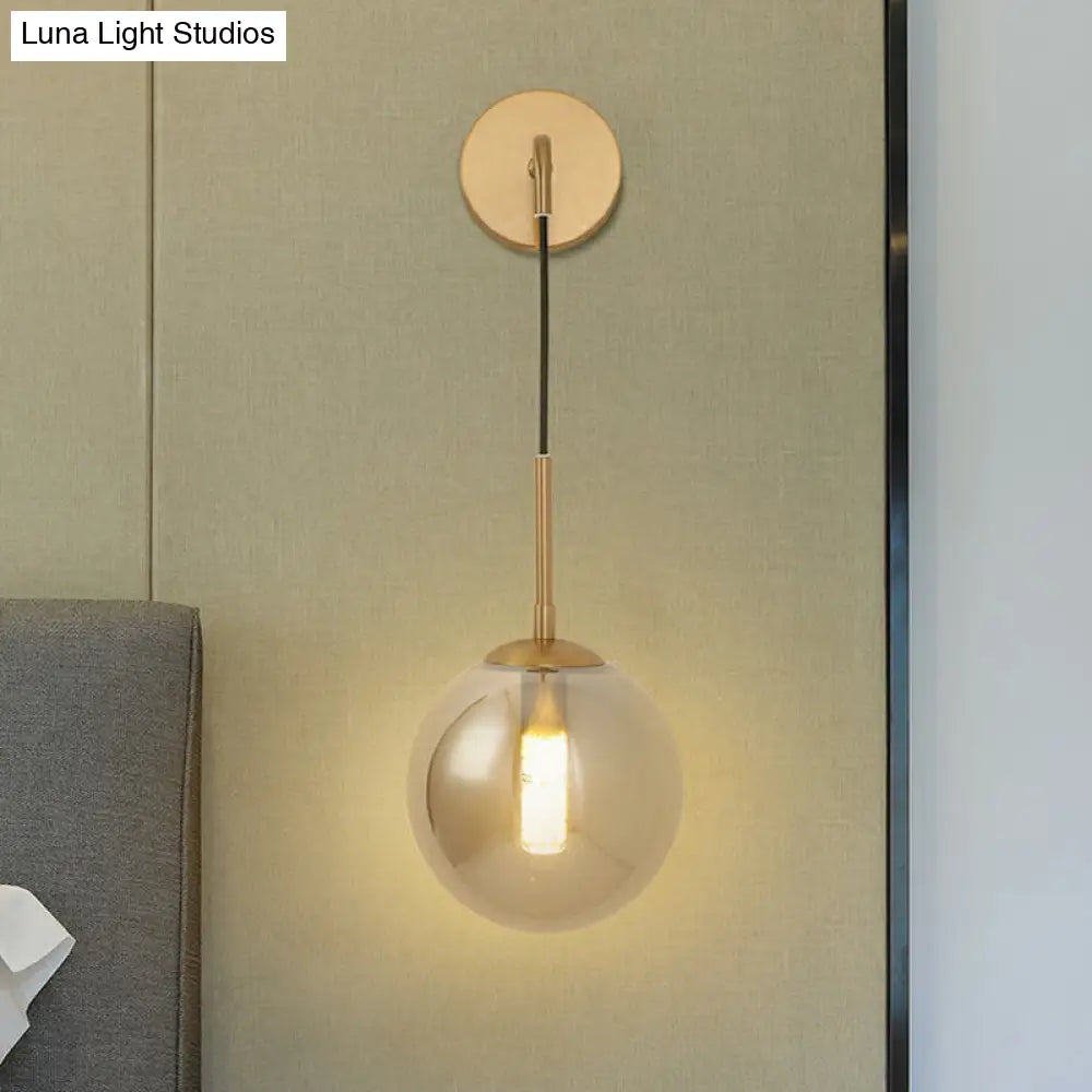 Sleek Silver Glass Ball Wall Hanging Lamp With Brass Mount - Perfect Bedroom Lighting Solution