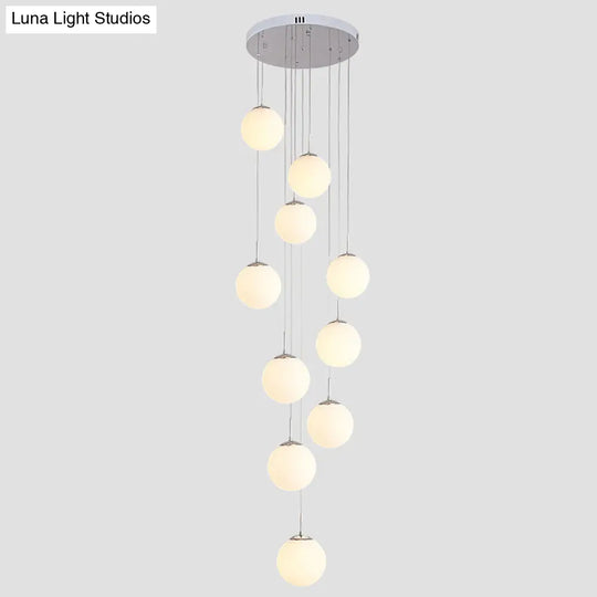 Sleek Silver Staircase Pendant Light With Cream Glass Shades - 10 Head Cluster Design