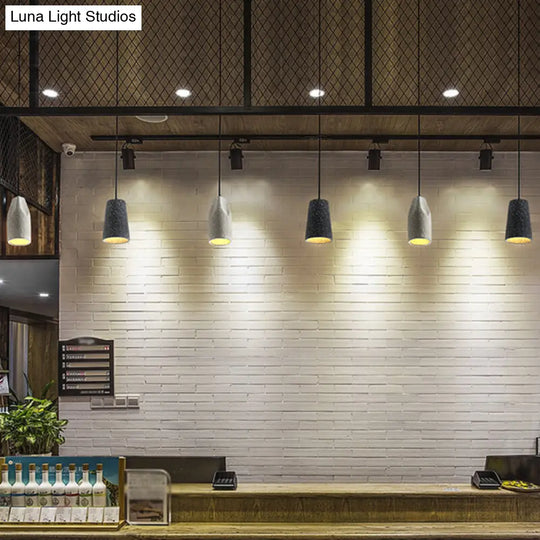 Sleek Single Pendant Light With Geometric Design Cement Finish For Modern Restaurant Ceilings