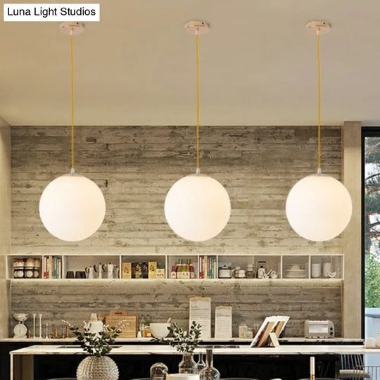 Sleek White Glass Pendant Light For Minimalist Table Settings