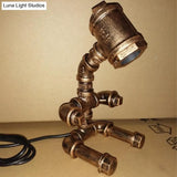 Small Brass Sitting Robot Desk Light Industrial Metal Bedside Table Lamp With Cord
This Revised
