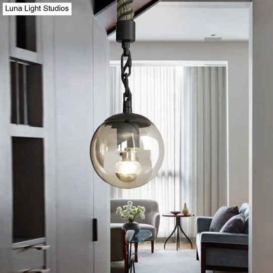 Stylish Black Ball Pendant Light With Tan Glass Perfect For Lodge Restaurant Or Home Decor