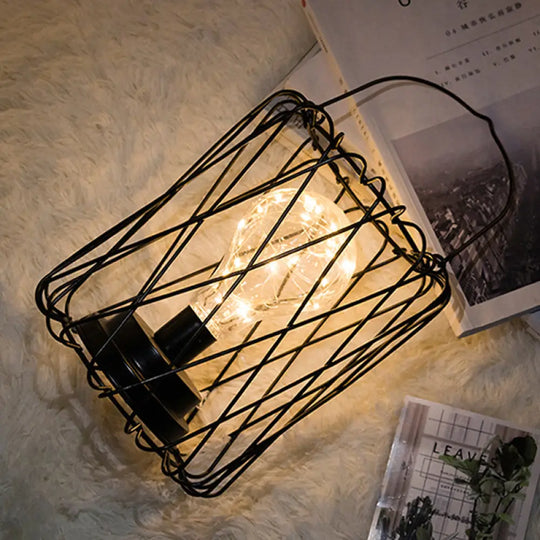 Stylish Black Metal Table Lamp With Cage Shade - Ideal For Bedside Or Loft Decor / Barrel