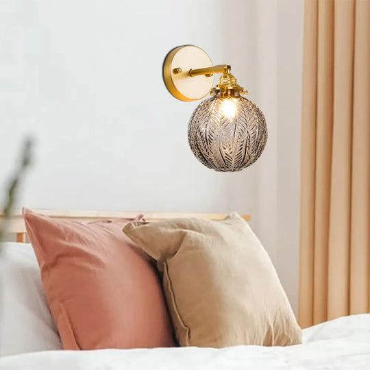 Textured Glass Ball Wall Light With Elegant Gold Mount And Adjustable Joint