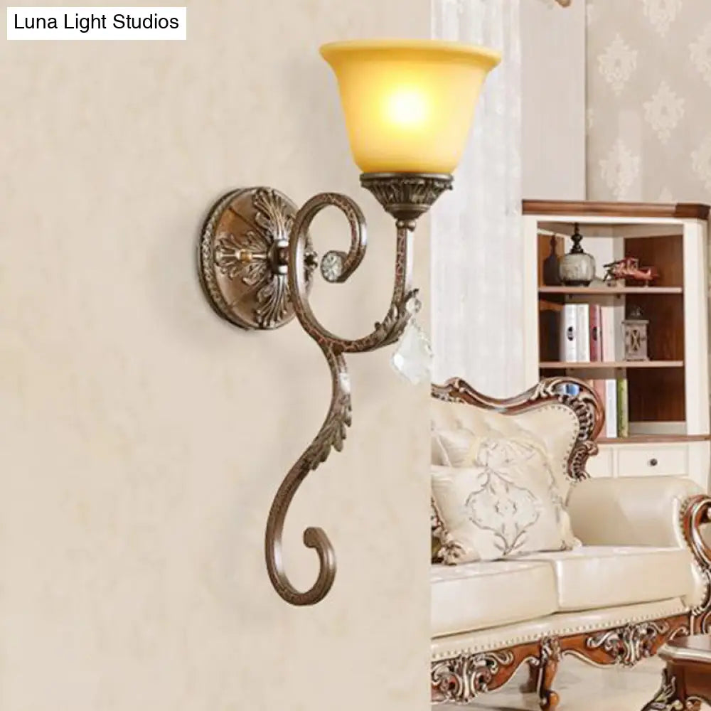 Traditional Amber Glass Sconce Lamp With Swirled Arm - Wall Mounted Corner Fixture In Bronze