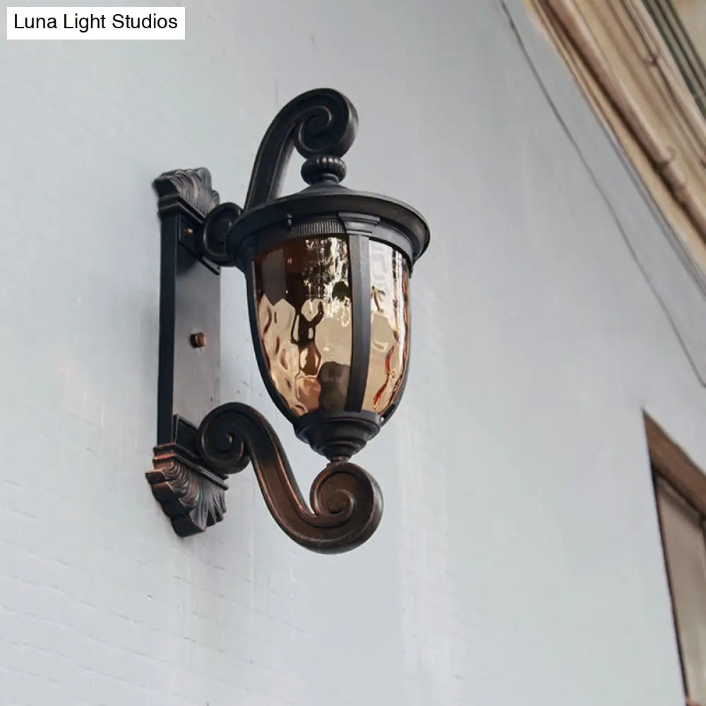 Traditional Amber Water Glass Sconce With Brown-Black Urn Shade - Elegant Wall Lighting