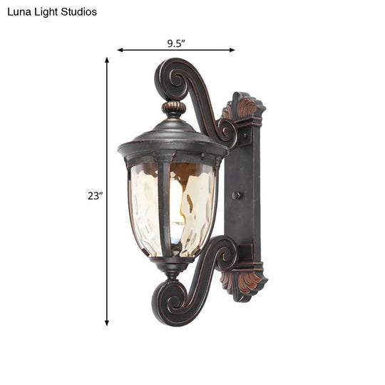 Traditional Amber Water Glass Sconce With Brown-Black Urn Shade - Elegant Wall Lighting