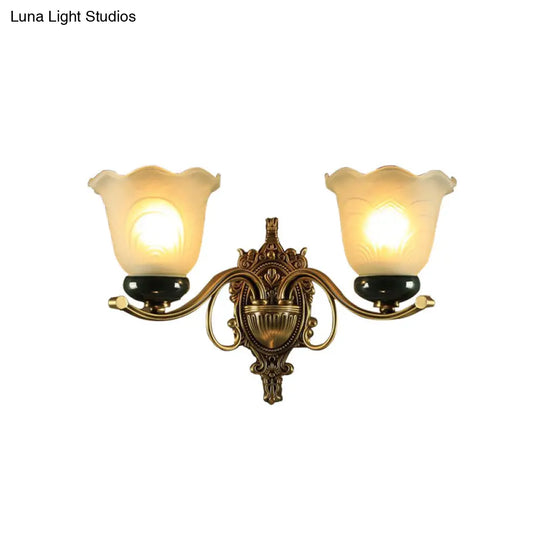 Traditional Brass Floral Wall Lamp With Frosted Glass And Carved Backplate