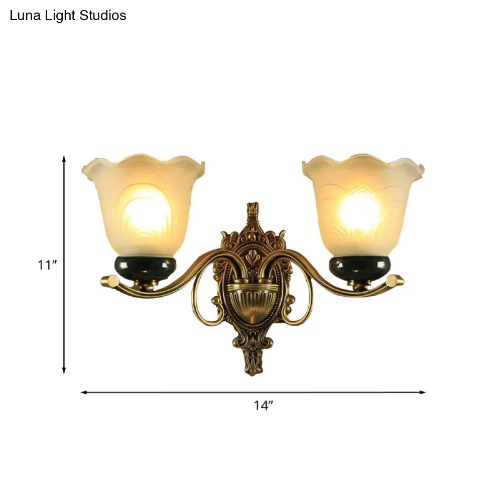 Traditional Brass Floral Wall Lamp With Frosted Glass And Carved Backplate