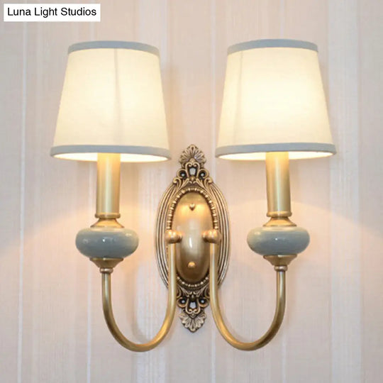 Traditional Brass Swoop Arm Living Room Sconce Light With Tapered Fabric Shade