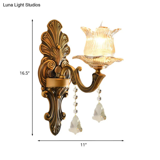 Traditional Brass Wall Sconce With Ribbed Glass And Floral Design