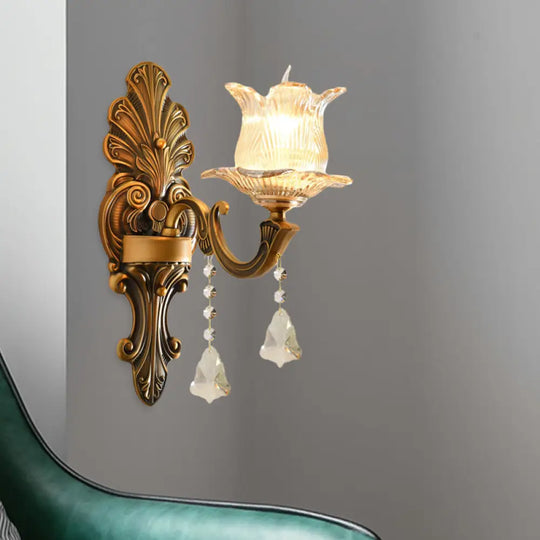 Traditional Brass Wall Sconce With Ribbed Glass And Floral Design