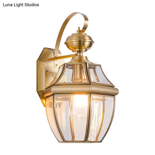 Traditional Clear Glass Globe Wall Light - 1-Light Outdoor Lantern Sconce In Brass