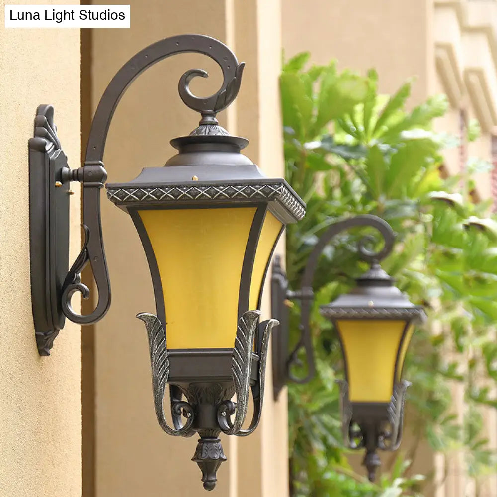 Traditional Coffee Square Bell Outdoor Wall Light Fixture With Tan Glass Mount - 1 Head