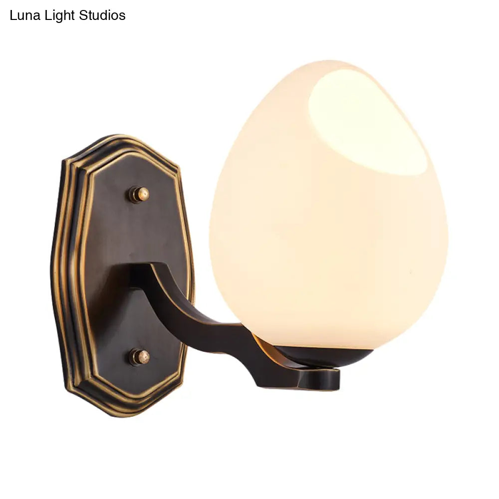 Traditional Egg-Shaped Wall Sconce With Frosted Glass Lamp In Black - 1 Light