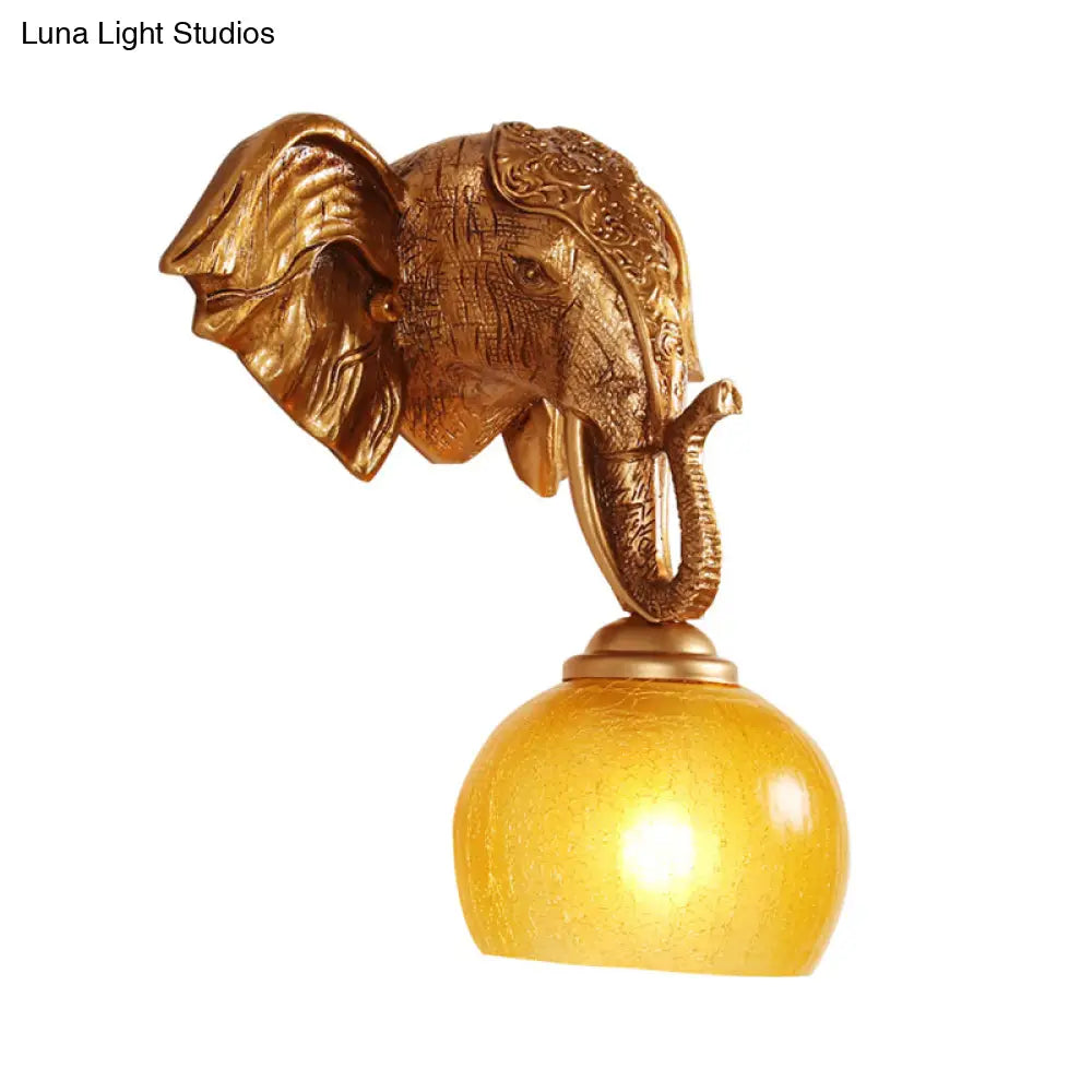 Traditional Gold Wall Sconce With Elephant Backplate And Frosted Glass Orb