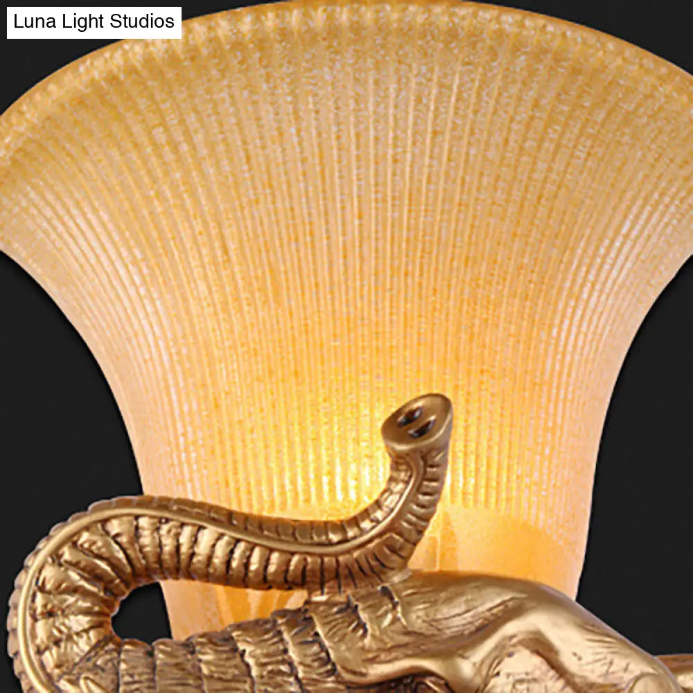 Traditional Style 1-Light Gold Wall Lamp With Elephant Design Bell Yellow Glass Bedroom Sconce