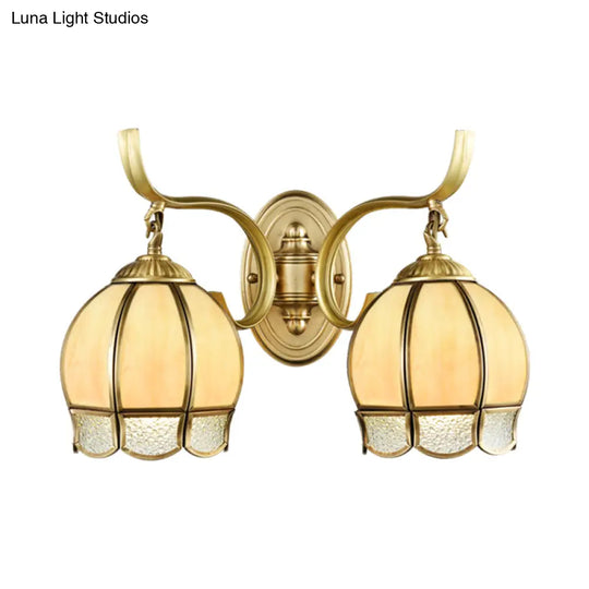 Traditional Tan Glass Brass Finish Sconce Light With Swirl Arm