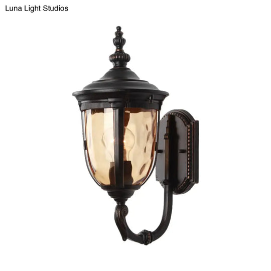 Traditional Wall Sconce: 1-Light Black Lamp With Amber Water Glass Urn Shade