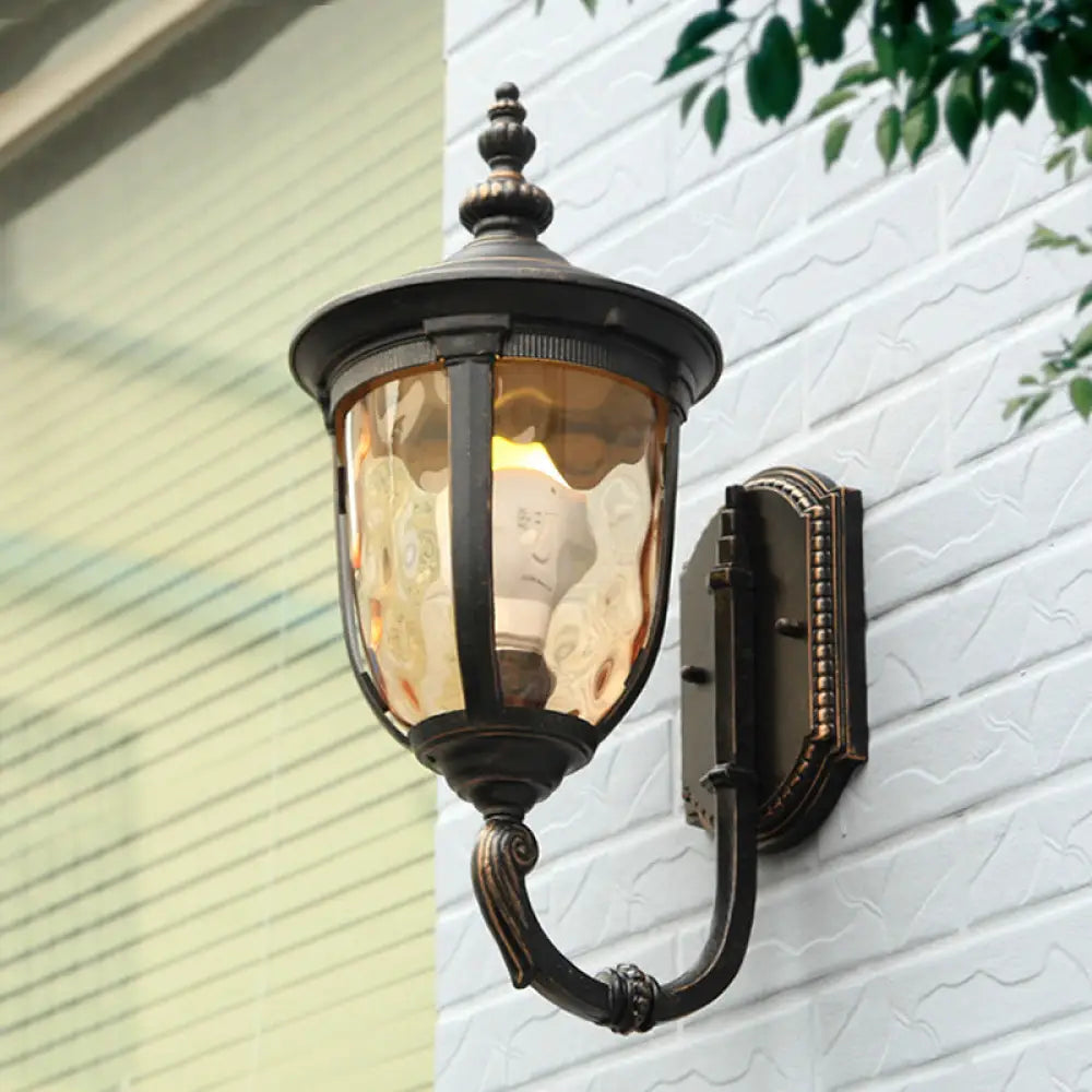 Traditional Wall Sconce: 1-Light Black Lamp With Amber Water Glass Urn Shade