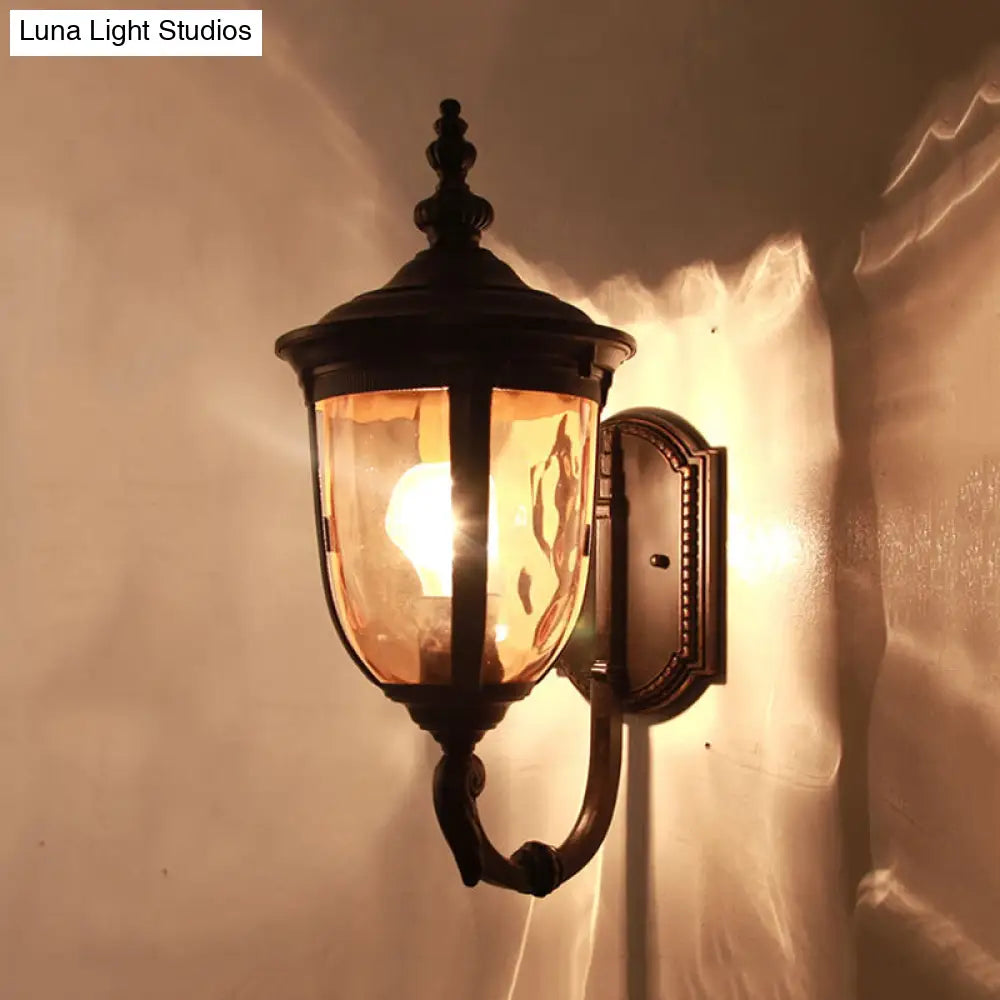 Traditional Wall Sconce: 1-Light Black Lamp With Amber Water Glass Urn Shade