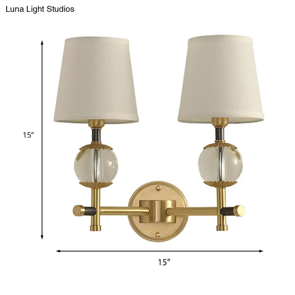 Traditional White Fabric Wall Sconce With Gold Conical Mount Crystal Ball Accent - 1/2 Heads Entry