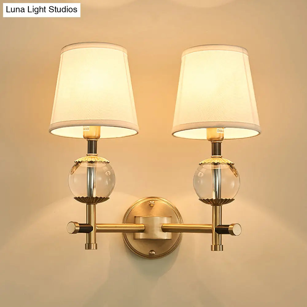 Traditional White Fabric Wall Sconce With Gold Conical Mount Crystal Ball Accent - 1/2 Heads Entry