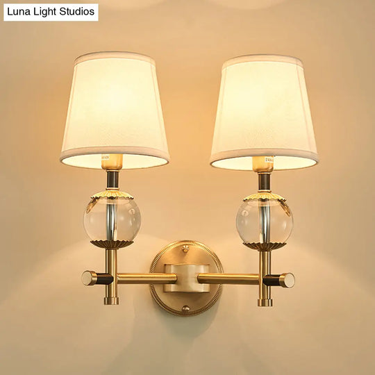 Traditional White Fabric Wall Sconce With Gold Conical Mount Crystal Ball Accent - 1/2 Heads Entry