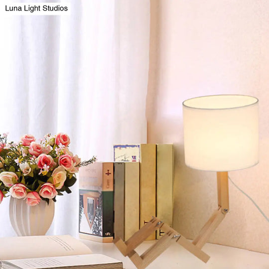 Modern Wood Man-Shaped Table Lamp With Book Rack And Cylinder Fabric Shade - Single