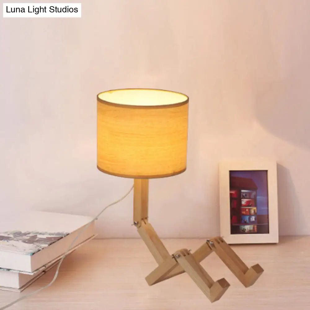 Modern Wood Man-Shaped Table Lamp With Book Rack And Cylinder Fabric Shade - Single