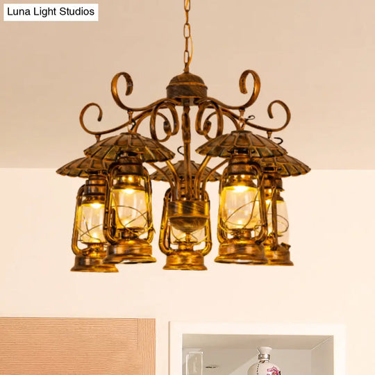 Village Style Metal And Clear Glass 5-Light Aged Brass Lantern Chandelier