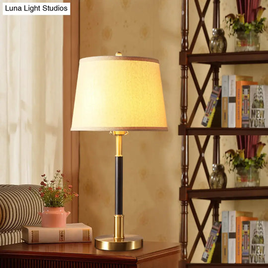 Vintage Brass Bedside Table Lamp With Single Bulb Tapered Design And Fabric Shade