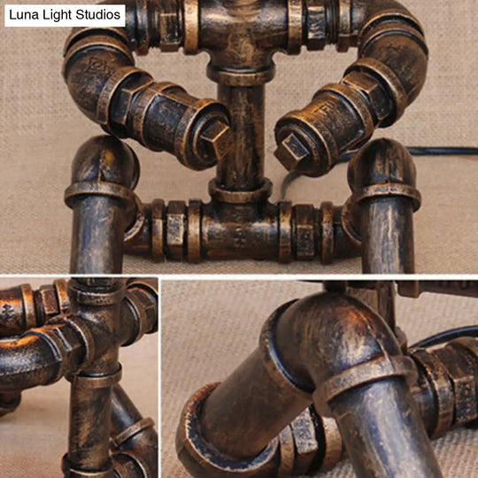 Vintage Stylish Sitting Robot Wrought Iron Table Lamp With Antique Brass Plumbing Pipe