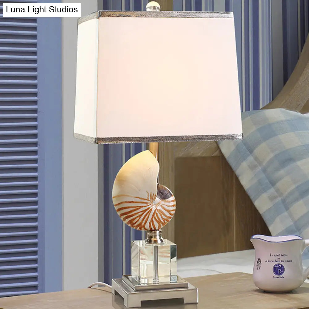 White Fabric Cuboid Nightstand Lamp With Decorative Nautilus Shell Accent - 1 Head Night Table Light