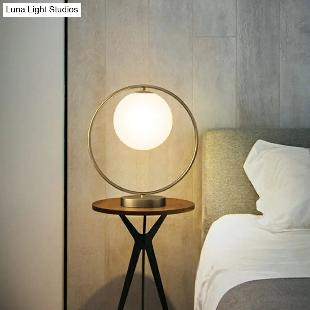 White Glass Ball Bedside Lamp With Gold Ring Decor - Single Minimalistic Table Light