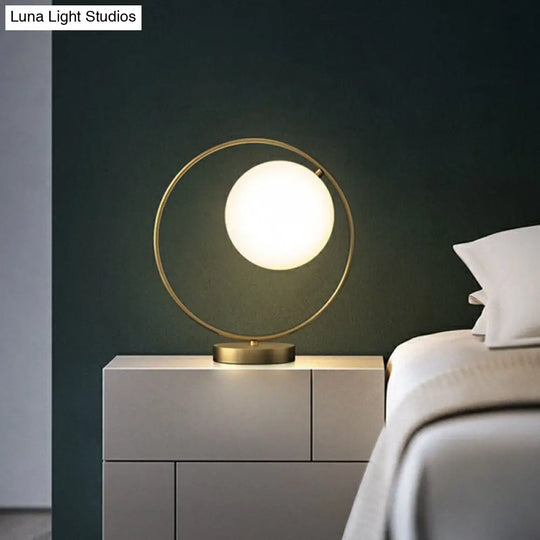 White Glass Ball Bedside Lamp With Gold Ring Decor - Single Minimalistic Table Light