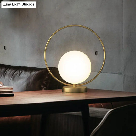 White Glass Ball Bedside Lamp With Gold Ring Decor - Single Minimalistic Table Light