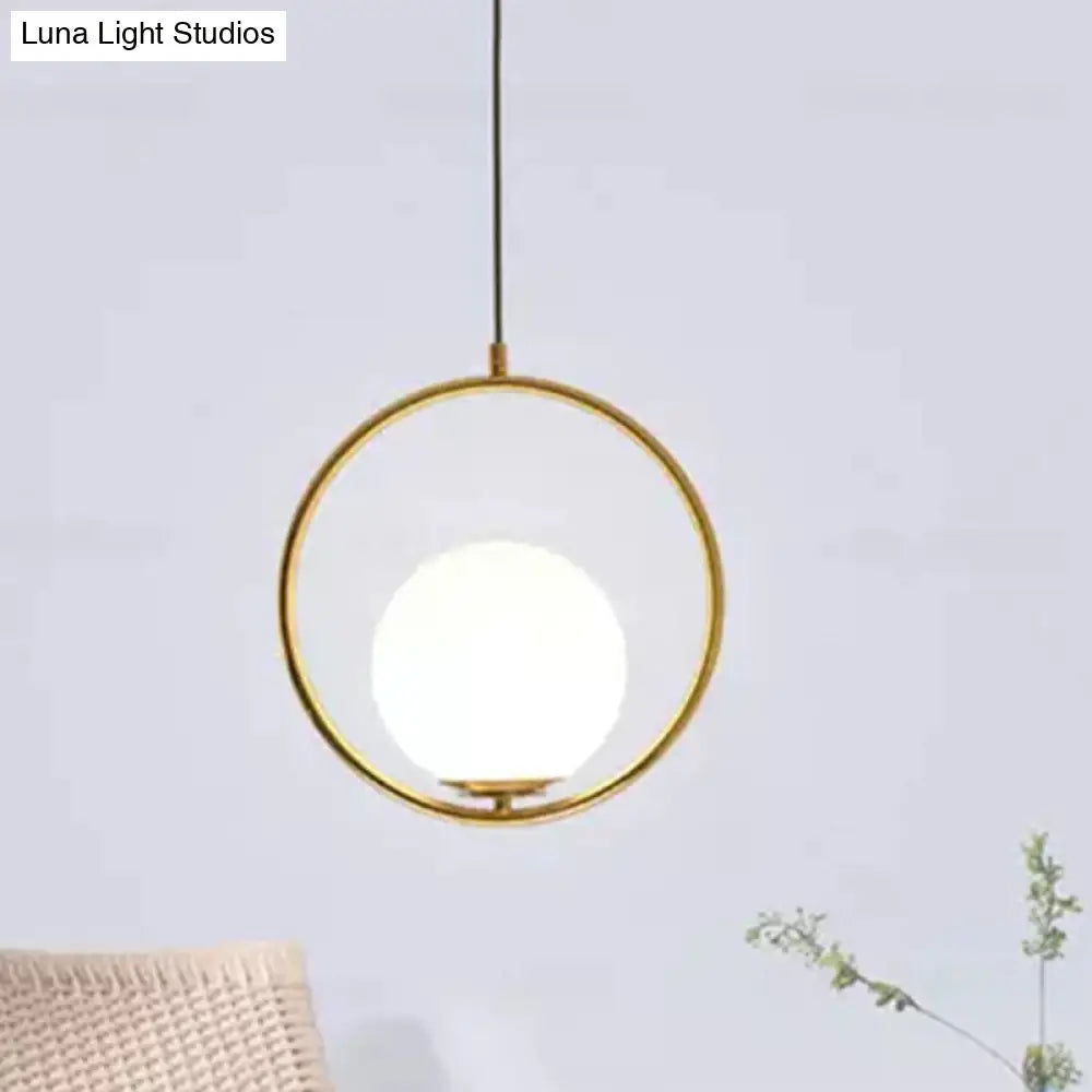 White Glass Pendant Light With Mid-Century Globe Design And Metal Ring