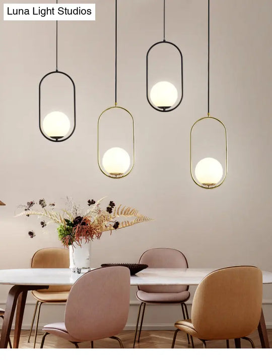 White Glass Pendant Light With Mid-Century Globe Design And Metal Ring