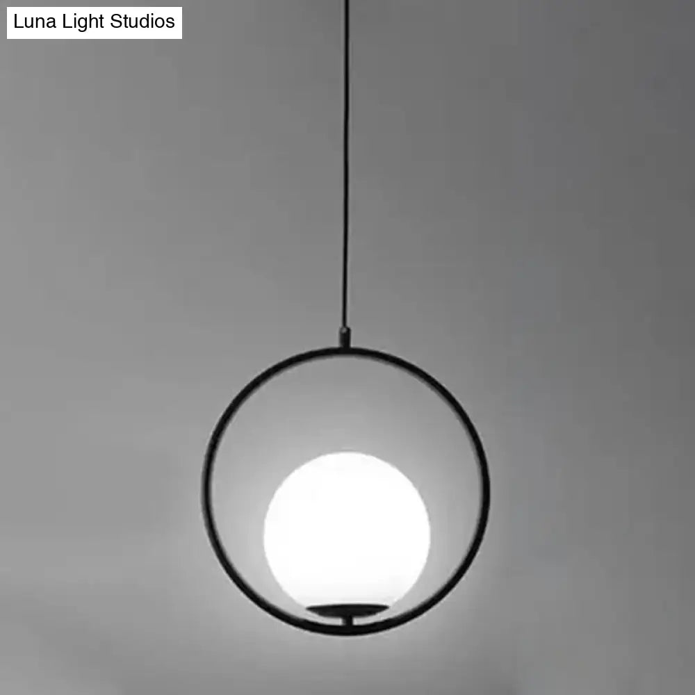 White Glass Pendant Light With Mid-Century Globe Design And Metal Ring