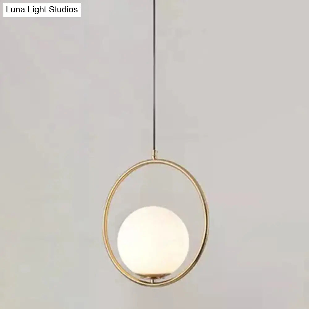 White Glass Pendant Light With Mid-Century Globe Design And Metal Ring