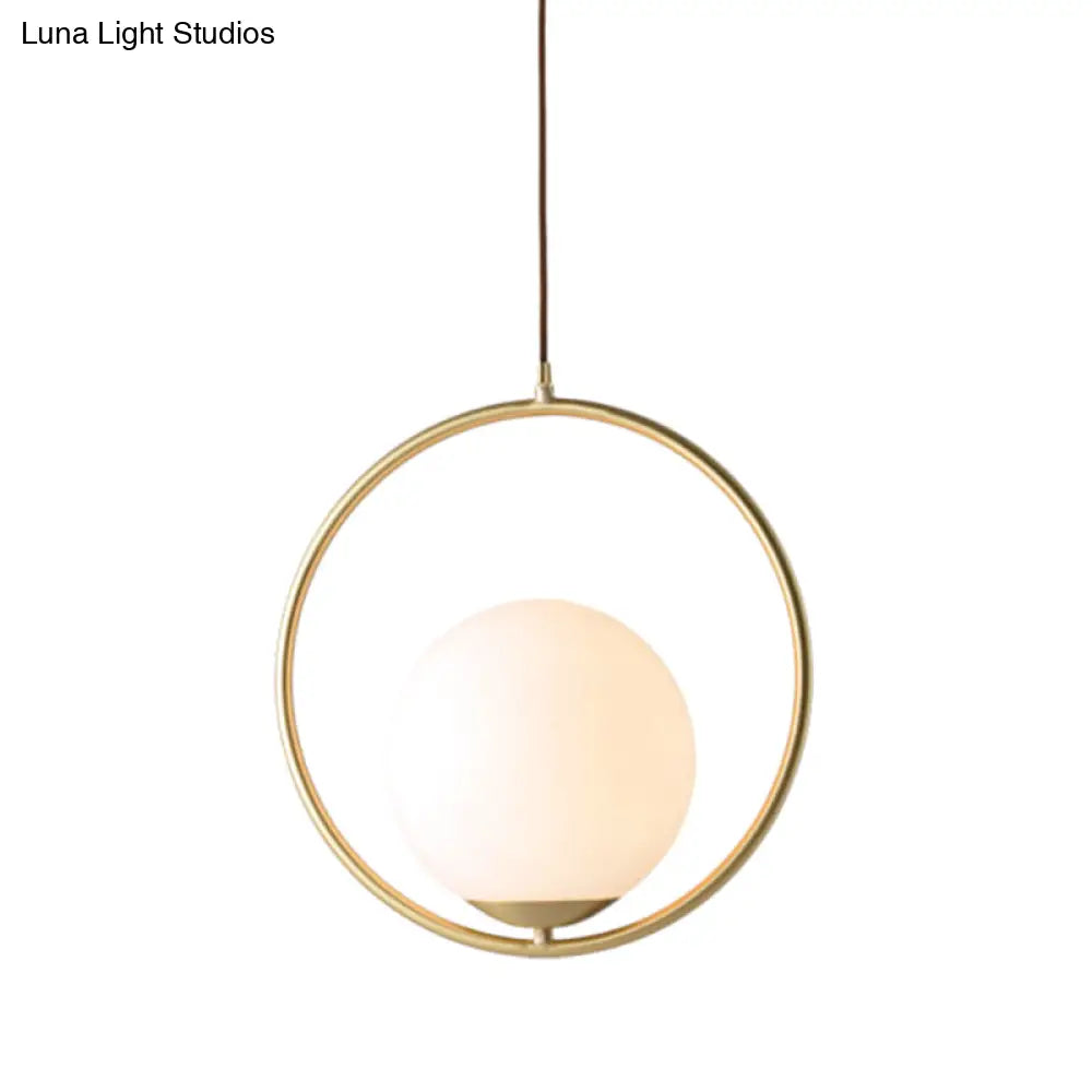 White Glass Pendant Light With Mid-Century Globe Design And Metal Ring