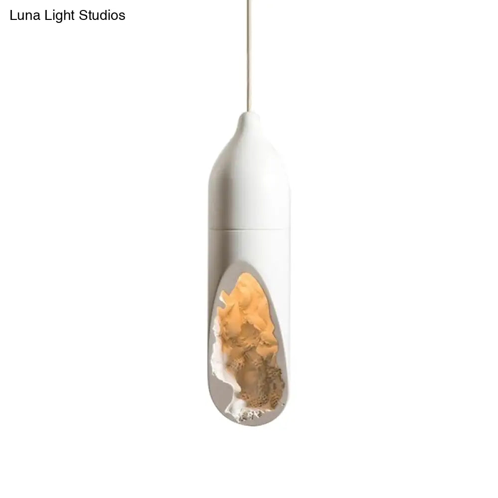 White Resin Farmhouse Pendant Light With Unique Pill Shape And Hollow-Out Design