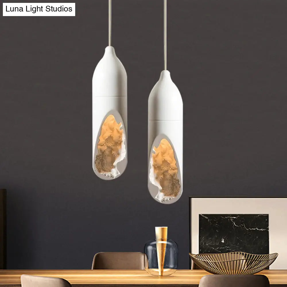 Resin Farmhouse Pendant Light With Hollow-Out Design In White - Pill-Shaped Ceiling Lamp For Dining